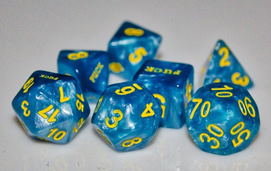 A beautiful set of polyhedral dice. Golden numbers, paired with pearlescent blue. Three dice have the word fuck instead of the 1. The d6,d10, and d20 all have a fuck side.